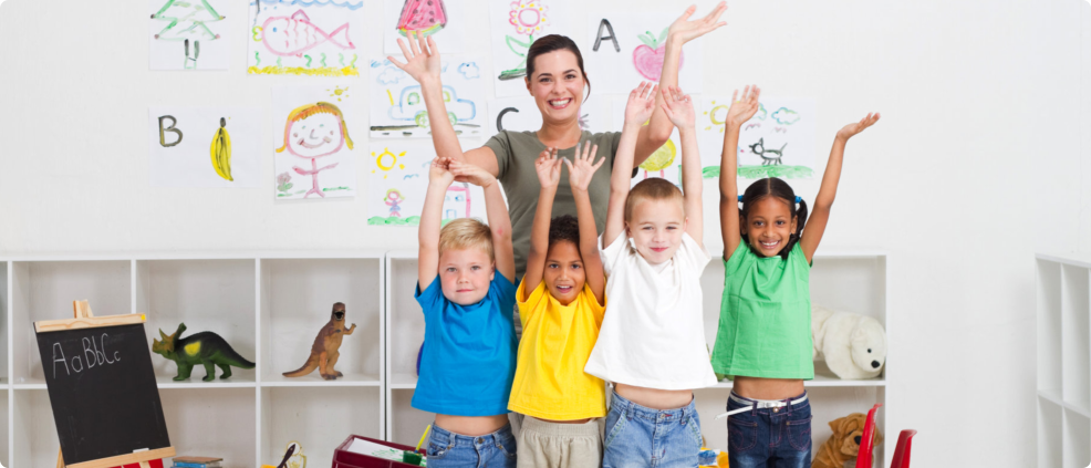 kids and teacher raising thir hands