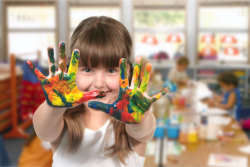 girl having a paint on her hands